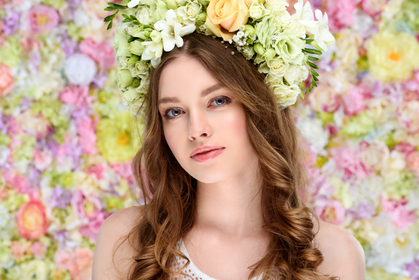 close-up portrait of attractive young woman in floral wreath - Photo, Image