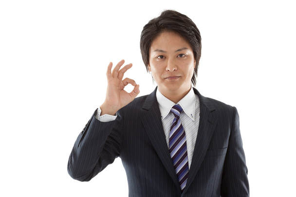 Young businessman with an OK sign - Photo, image