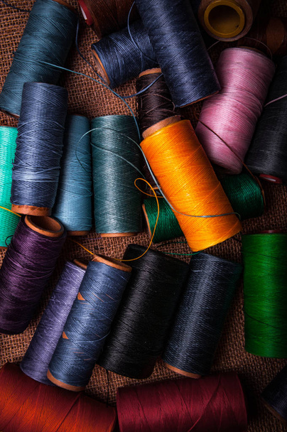 colorful rolls of threads, needle craft sewing tools - 写真・画像