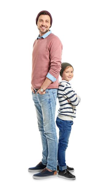 Stylish father and son on white background - Foto, Imagen