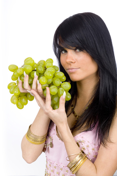 Brunette with green grapes - Fotoğraf, Görsel