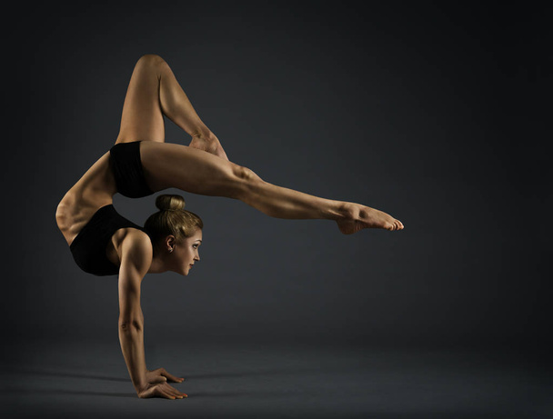 Flexible Woman Circus Gymnast, Gymnastics Hand Stand, Acrobat Standing on Hands, Yoga Headstand Backbend - Фото, зображення
