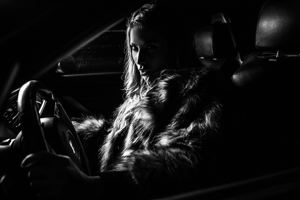 Luxury woman in a car. - Фото, изображение