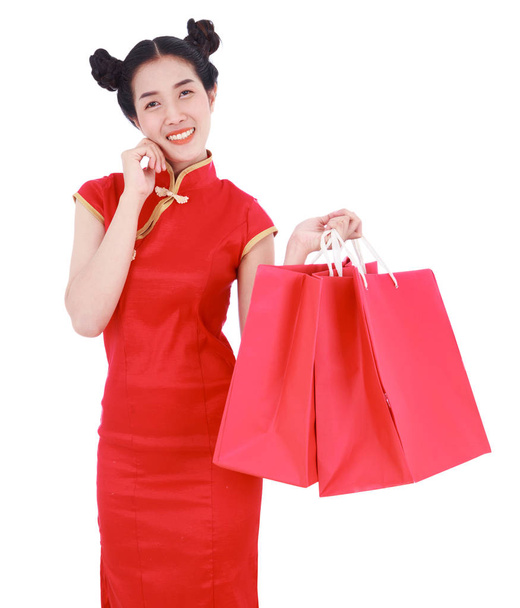 happy woman holding shopping bag on chinese new year celebration - Photo, image