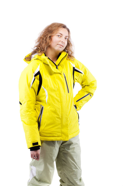 female skier in yellow jacket - 写真・画像