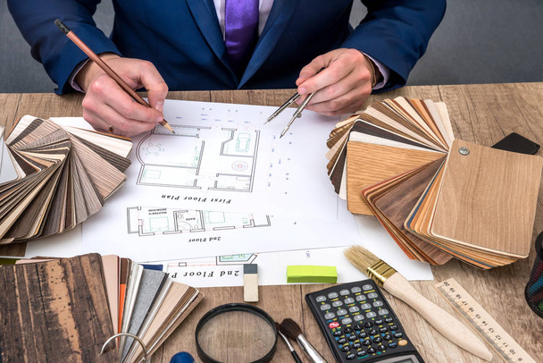 designer working with architect sketching construction project on wooden table - Photo, Image
