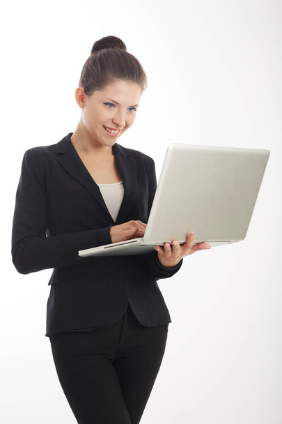 young businesswoman working on laptop computer - Фото, изображение