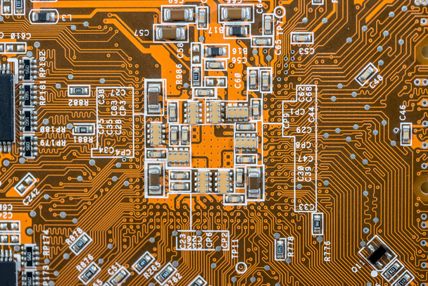 old orange motherboard as background. electronic components. - Zdjęcie, obraz