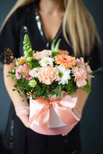 nice bouquet in the hands of woman, close up - 写真・画像