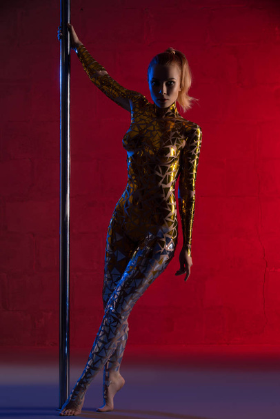 Gorgeous woman with gold tape body art view - Foto, Bild