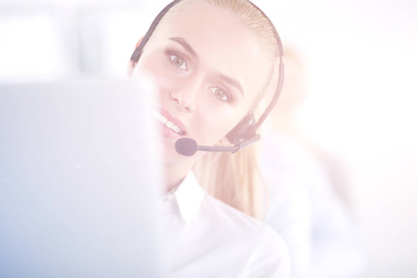 Attractive positive young businesspeople and colleagues in a call center office. Businesspeople - Foto, afbeelding