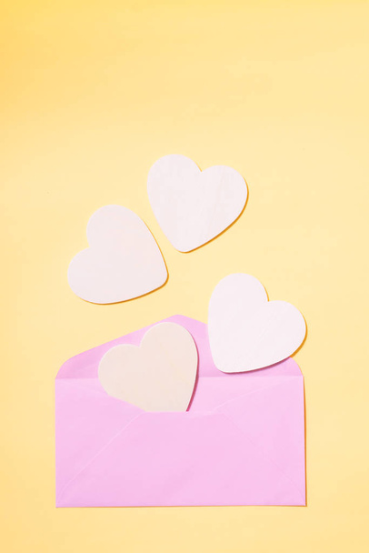 Pink envelope with white heart inside - Zdjęcie, obraz