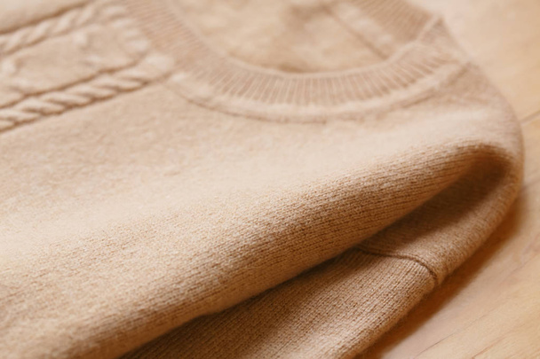 Beautiful, luxurious, knitted sweater in beige, autumn, winter, warm. - Foto, afbeelding