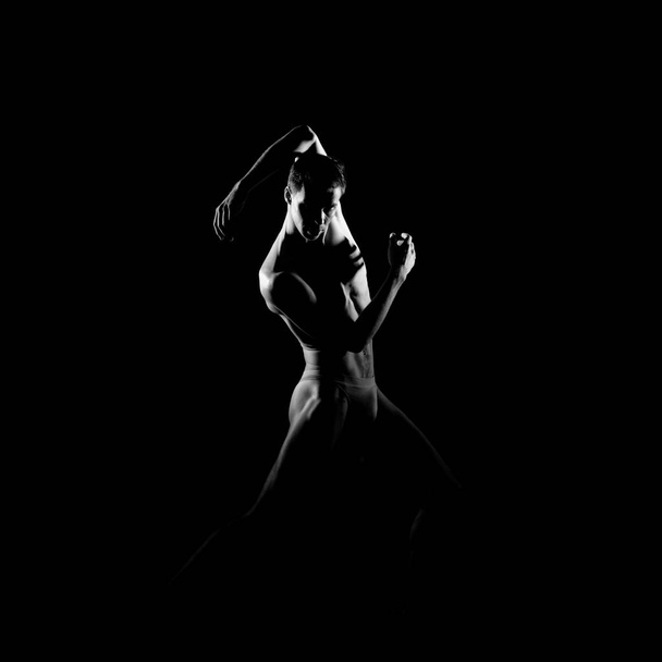 Black and white silhouette trace of male ballet dancer. - Фото, зображення