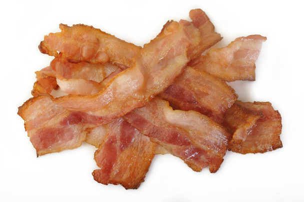 Cooked bacon rashers on white background - Photo, Image