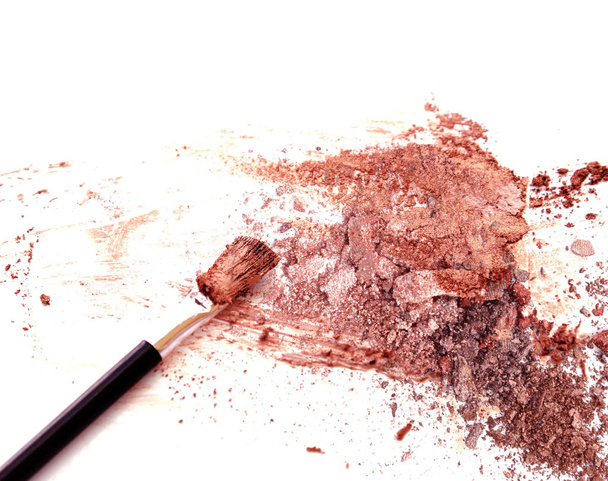 Make up. Pink Gold color eye shadow on white. - Фото, изображение