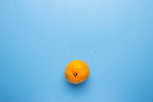 Fresh orange on blue background - Zdjęcie, obraz