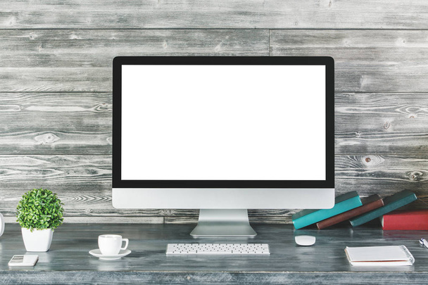 Contemporary desktop with blank white computer  - Zdjęcie, obraz