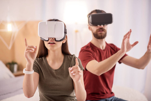 Speechless cute couple wondering in VR - Photo, Image