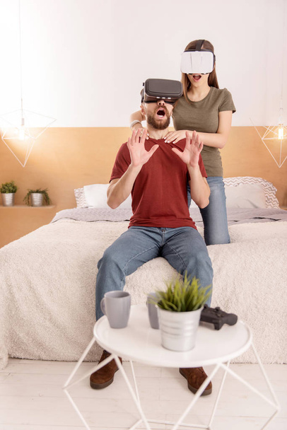 Pleasant astonished couple perceiving VR - Fotoğraf, Görsel