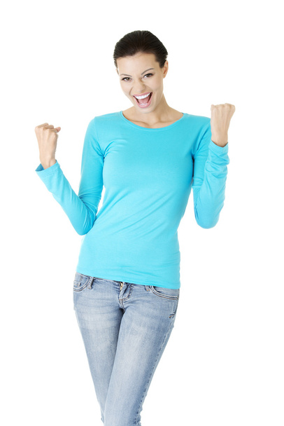 Excited happy young woman with fists up - Foto, immagini