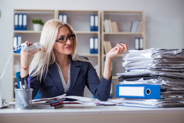 Busy businesswoman working in office at desk - Photo, Image