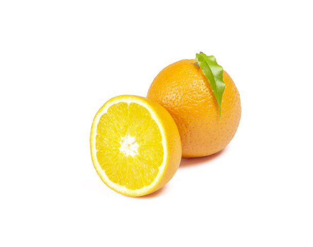 On a white background there is a whole orange and half an orange - Foto, Bild