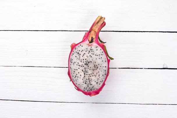 Dragon Fruit. Tropical Fruits. On a wooden background. Top view. Copy space. - Fotografie, Obrázek