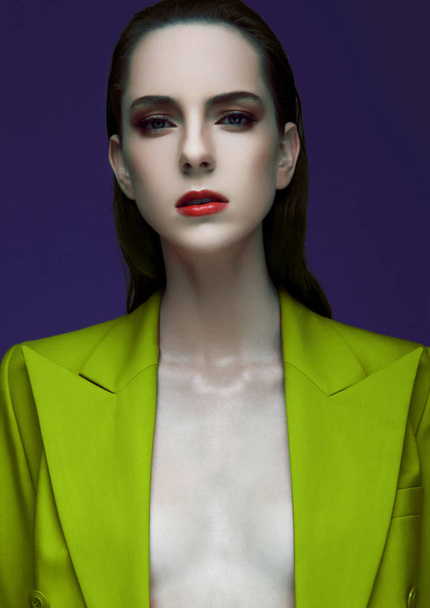 Fashion model with wet hair wearing green coat  - Фото, зображення