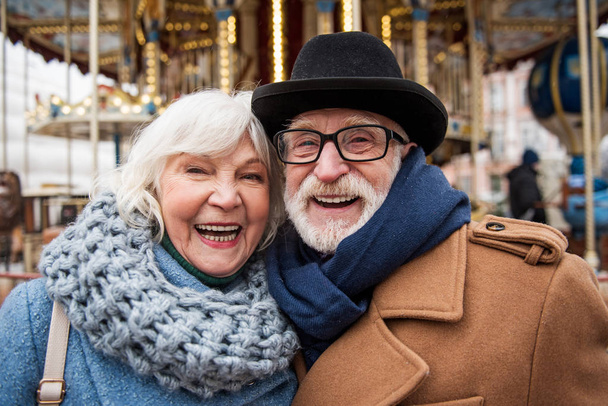 Excited senior man and woman standing on street - Fotoğraf, Görsel