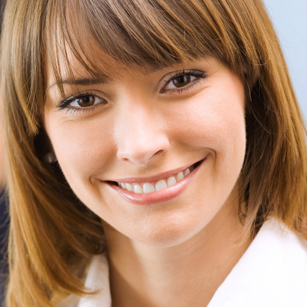 Portrait of happy smiling businesswoman at office - Foto, immagini