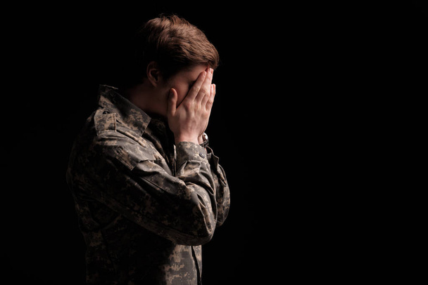 Sad male cadet feeling helpless - Foto, Imagen