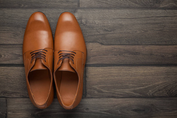 brown shoes on a wooden - Foto, Imagen