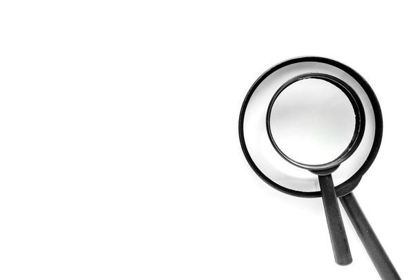 Two size of magnifying glass on the right of white background with copy space - Photo, Image