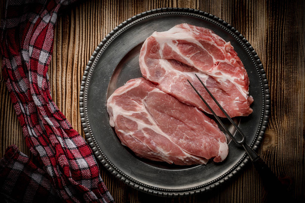 Slices of raw pork neck. - Zdjęcie, obraz