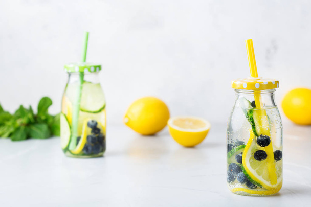 Fresh cool lemon cucumber berry infused water detox drink - Photo, Image