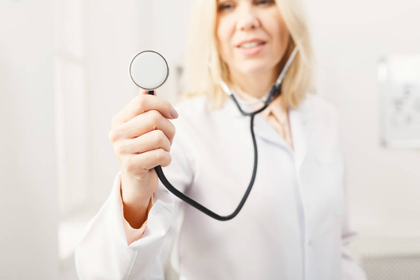 Female hand holding stethoscope closeup - Photo, image