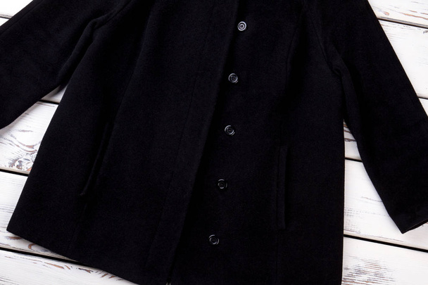 Female black buttoned coat. - Zdjęcie, obraz