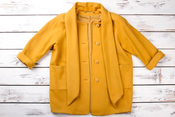 Female elegant yellow cashmere topcoat. - Photo, Image
