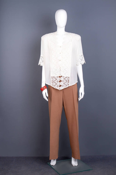 Female mannequin in white silk blouse. - Photo, image