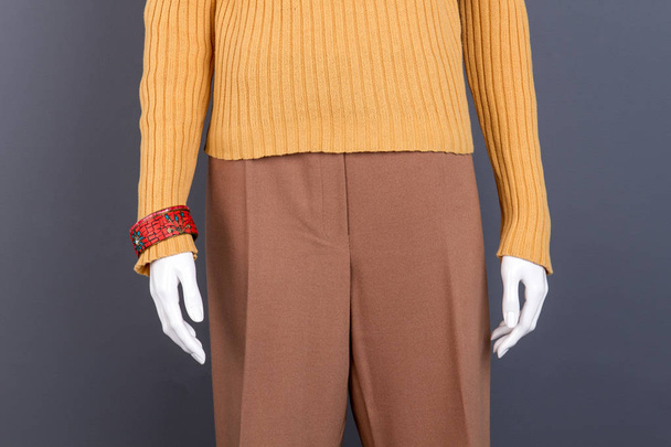Close up female sweater, trousers, bracelet. - Photo, Image