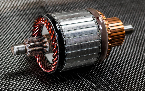 Automotive generator armature on carbon fiber - Photo, Image