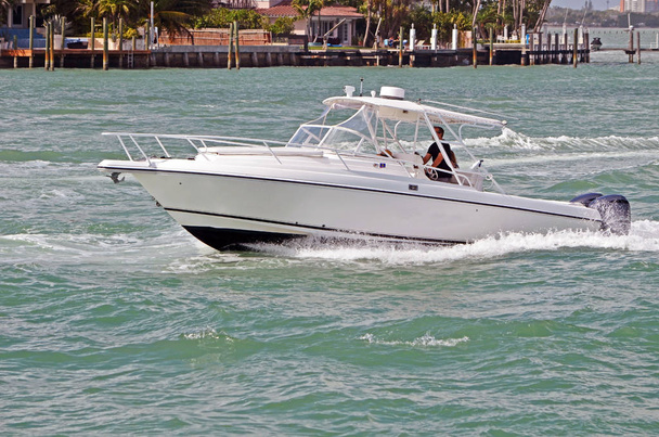 Black and white sports fishing boat cruising on the florida intra-coastal waterway off Miami Beach - Photo, Image