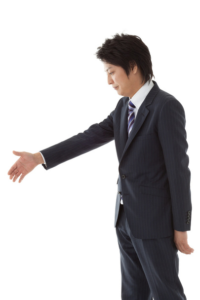 Young businessman for a handshake - Фото, изображение