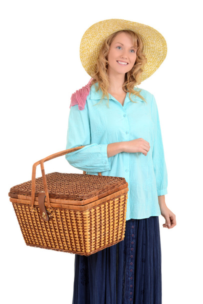 Blond woman carrying picnic basket - Foto, immagini
