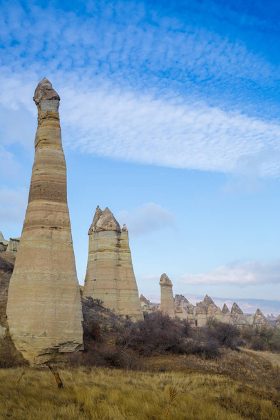 Volcanic rock formations known as Fairy Chimneys in Cappadocia, Turkey. - Fotoğraf, Görsel