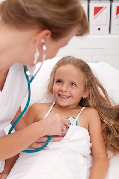 Healthcare professional checking up on little girl - Photo, Image