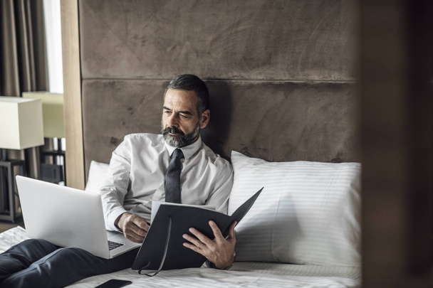 Businessman Working at Hotel Room - Photo, Image