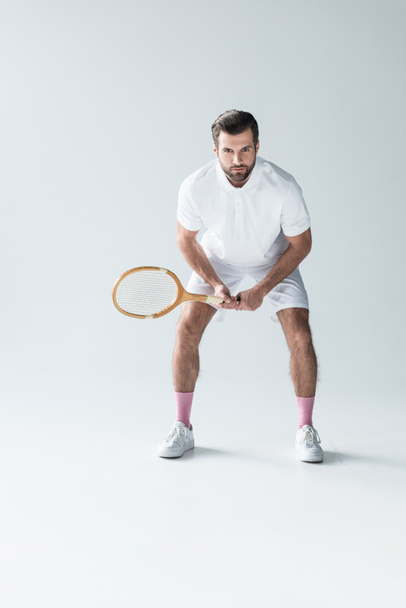handsome tennis player with tennis racket on grey - Zdjęcie, obraz