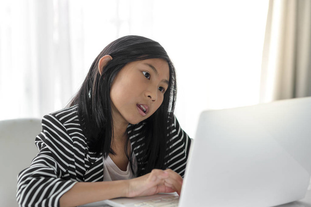 Happy girl using white laptop at home. - Фото, зображення